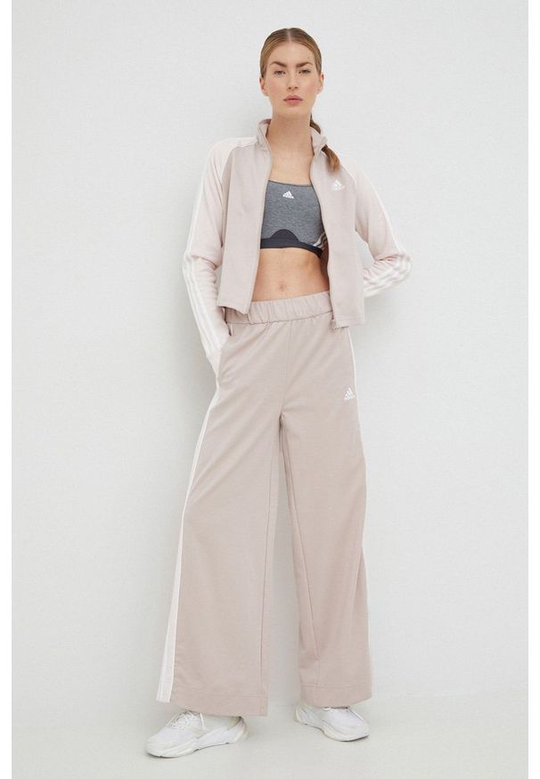 Adidas - adidas dres damski kolor beżowy. Kolor: beżowy. Materiał: dresówka