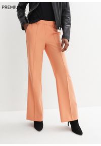 bonprix - Spodnie wełniane z chłodzącej wełny. Kolor: pomarańczowy. Materiał: wełna