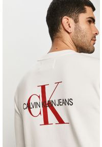 Calvin Klein Jeans - Bluza bawełniana. Okazja: na co dzień. Typ kołnierza: bez kaptura. Kolor: biały. Materiał: bawełna. Wzór: nadruk. Styl: casual #1