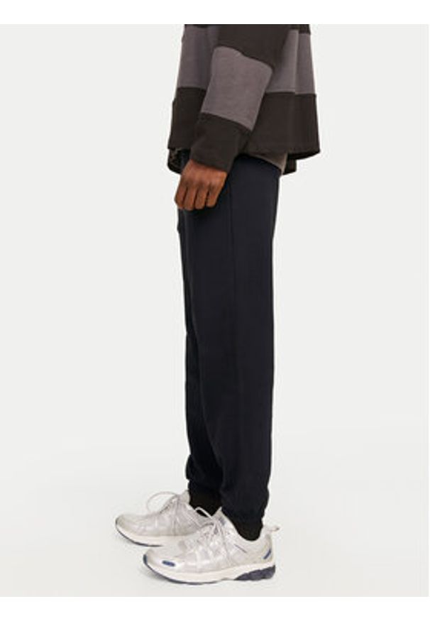 Jack & Jones Spodnie dresowe Morgan 12257964 Czarny Regular Fit. Kolor: czarny. Materiał: bawełna, syntetyk