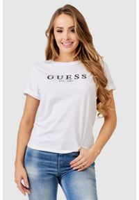 Guess - GUESS Biały t-shirt damski z czarnym logo. Kolor: biały. Materiał: bawełna. Długość rękawa: krótki rękaw. Wzór: nadruk
