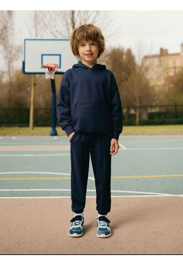 Sinsay - Spodnie dresowe jogger - granatowy. Kolor: niebieski. Materiał: dresówka