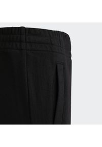 Spodnie dresowe dla dzieci Adidas Brandlove Czarny. Kolor: czarny, biały, wielokolorowy. Materiał: dresówka. Sport: joga i pilates