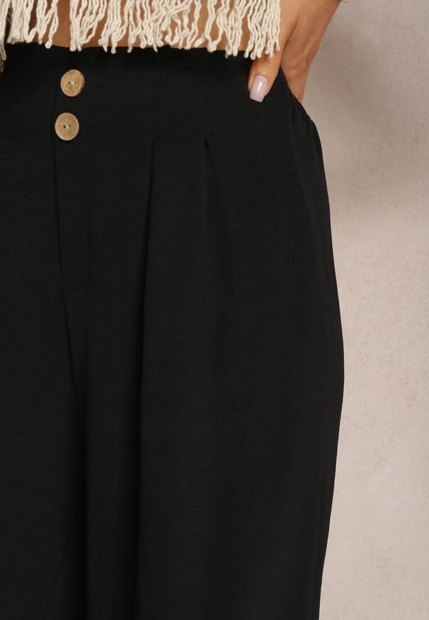 Renee - Czarne Spodnie w Stylu Alladynek High Waist Wykończone Gumką w Pasie Riselma. Okazja: na co dzień. Stan: podwyższony. Kolor: czarny. Styl: sportowy, casual