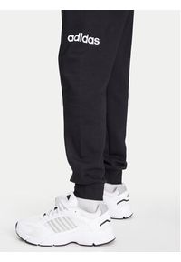 Adidas - adidas Spodnie dresowe Essentials Linear Fleece JN1786 Czarny Regular Fit. Kolor: czarny. Materiał: bawełna #5