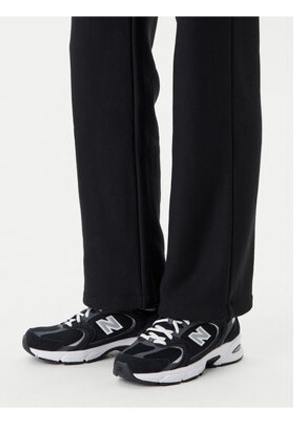Champion Spodnie dresowe 117983 Czarny Slim Fit. Kolor: czarny. Materiał: bawełna