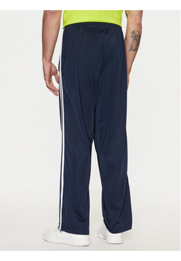 Adidas - adidas Spodnie dresowe adicolor Classics Firebird IM9471 Granatowy Regular Fit. Kolor: niebieski. Materiał: syntetyk