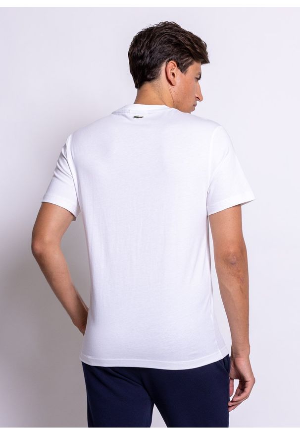 Koszulka męska Lacoste (TH0063-001). Typ kołnierza: polo. Kolor: biały. Materiał: dzianina. Długość: krótkie. Sezon: lato. Sport: bieganie