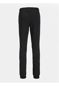 Jack&Jones Junior Spodnie dresowe Gordon 12249856 Czarny Slim Fit. Kolor: czarny. Materiał: syntetyk