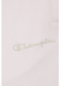 Champion spodnie 217404 kolor różowy z aplikacją. Kolor: różowy. Materiał: włókno, dzianina, materiał. Wzór: aplikacja #3