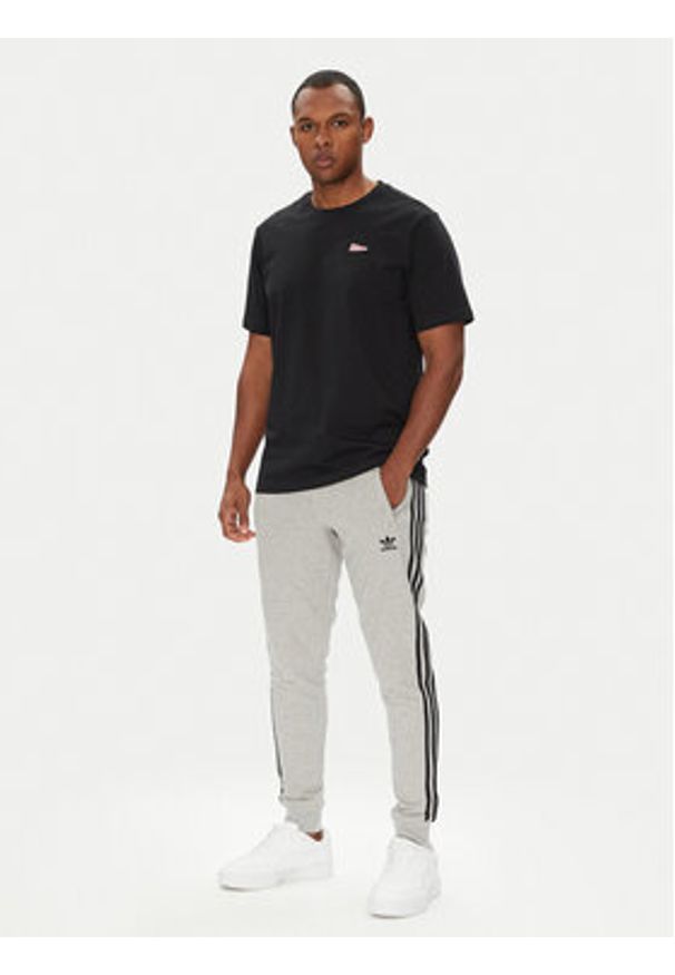Adidas - adidas Spodnie dresowe adicolor 3-Stripes JY1387 Szary Slim Fit. Kolor: szary. Materiał: bawełna