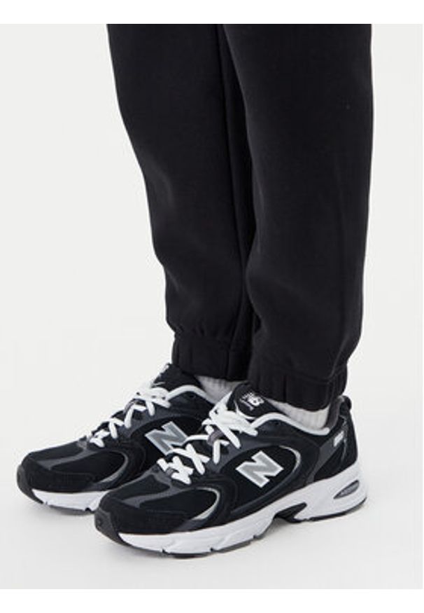 Champion Spodnie dresowe 117872 Czarny Slim Fit. Kolor: czarny. Materiał: bawełna
