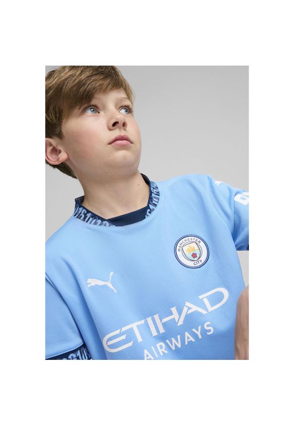 Puma - Młodzieżowa koszulka domowa Manchester City 24/25 PUMA Team Light Blue Marine. Kolor: niebieski