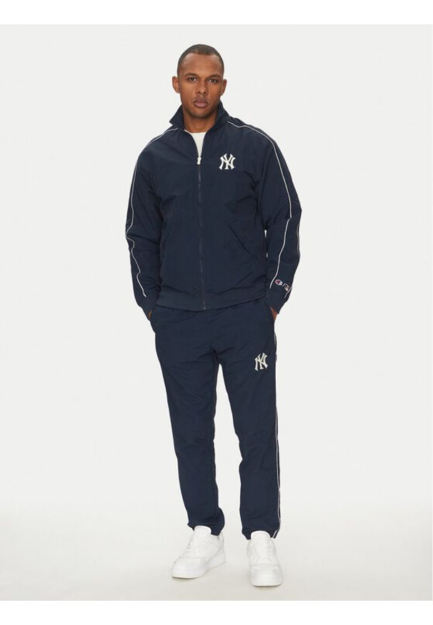 Champion Komplet dresowy 221238 Granatowy Regular Fit. Kolor: niebieski. Materiał: syntetyk