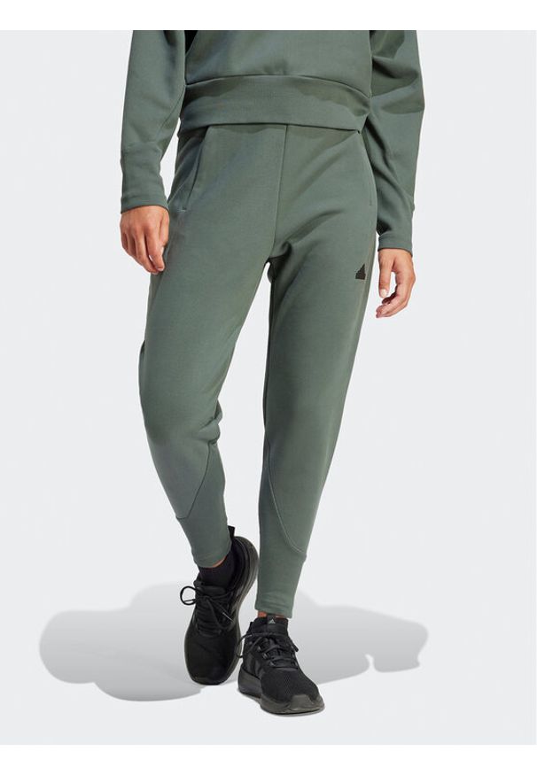 Adidas - adidas Spodnie dresowe Z.N.E. Winterized IS4333 Zielony Regular Fit. Kolor: zielony. Materiał: syntetyk
