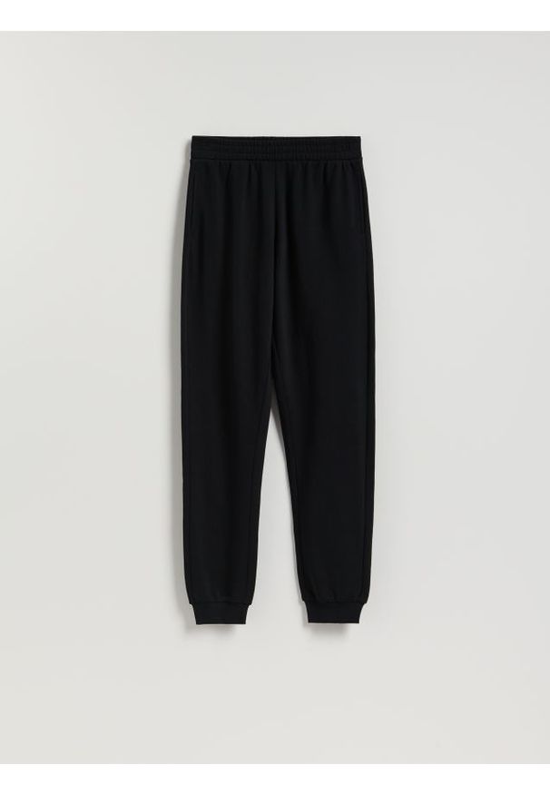 Reserved - Spodnie dresowe long leg - czarny. Kolor: czarny. Materiał: dresówka