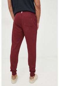 TOMMY HILFIGER - Tommy Hilfiger spodnie dresowe bawełniane męskie kolor bordowy z aplikacją. Kolor: czerwony. Materiał: bawełna, dresówka. Wzór: aplikacja #2