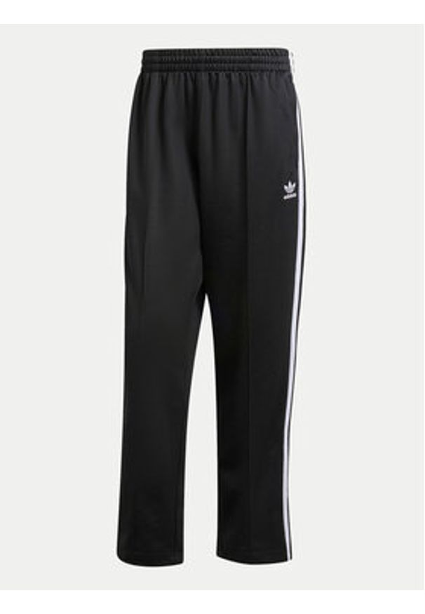 Adidas - adidas Spodnie dresowe adicolor Firebird IZ4801 Czarny Baggy Fit. Kolor: czarny. Materiał: syntetyk