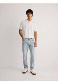 Reserved - Jeansy slim z efektem sprania - niebieski. Kolor: niebieski #1
