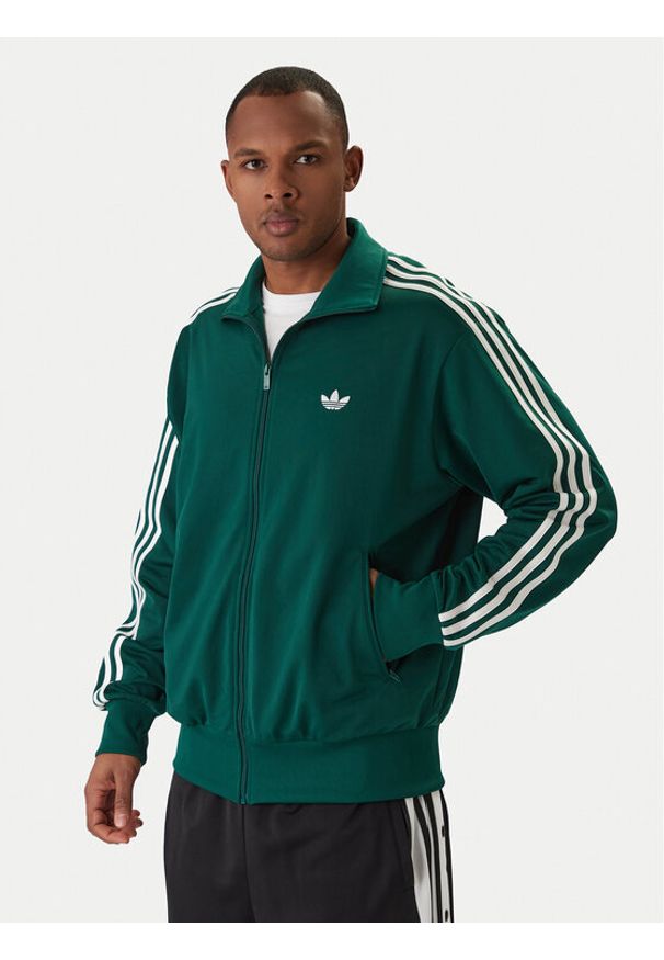 Adidas - adidas Bluza Firebird KD8314 Zielony Loose Fit. Kolor: zielony. Materiał: syntetyk