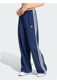 Adidas - adidas Spodnie dresowe 165468 Niebieski jasny Loose Fit. Kolor: niebieski. Materiał: dresówka #1