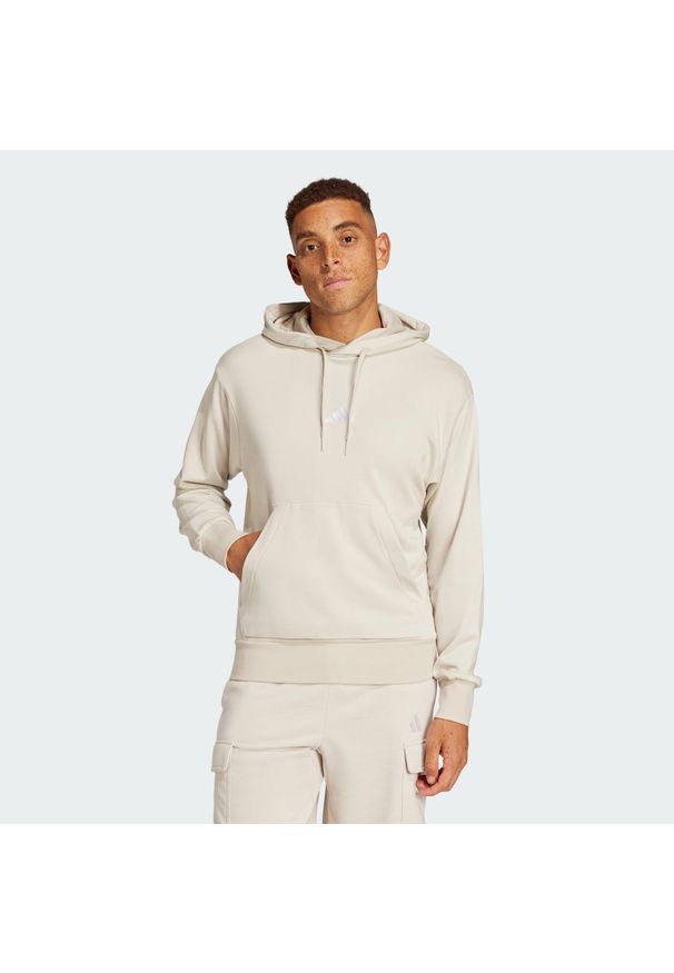 Adidas - Bluza z kapturem Essentials Feelcozy French Terry. Typ kołnierza: kaptur. Kolor: wielokolorowy, biały, beżowy. Materiał: materiał. Sport: fitness