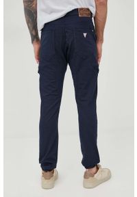 Guess spodnie z domieszką lnu męskie kolor granatowy joggery. Kolor: niebieski. Materiał: len #4