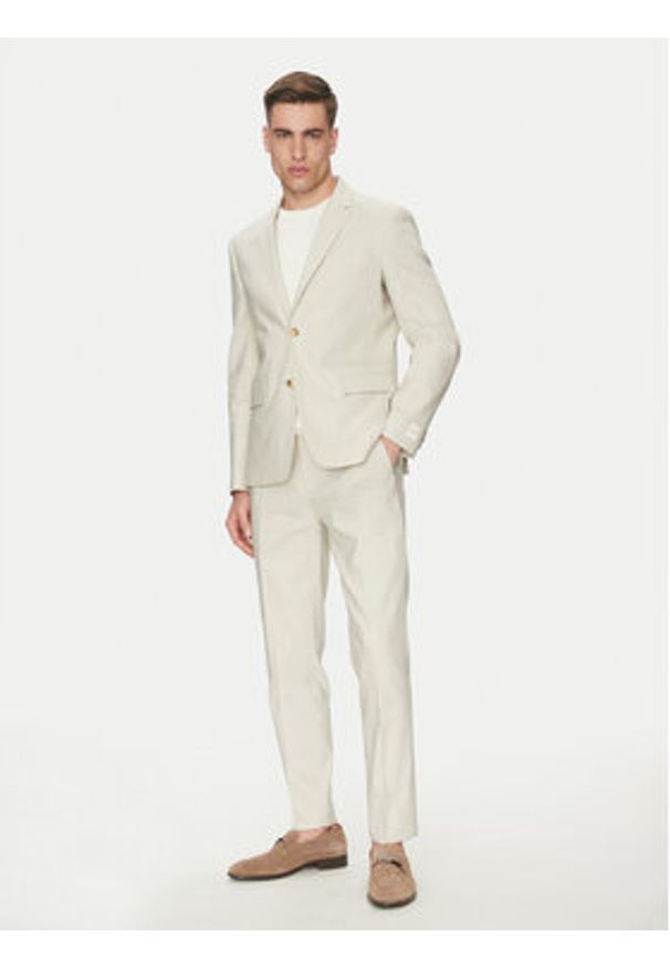 Calvin Klein Spodnie materiałowe K10K114400 Beżowy Slim Fit. Kolor: beżowy. Materiał: lyocell, len