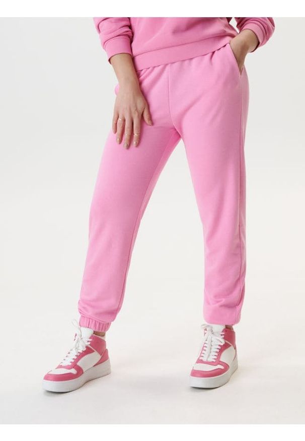 Sinsay - Spodnie dresowe jogger - różowy. Kolor: różowy. Materiał: dresówka