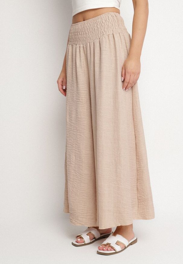 Born2be - Beżowe Spodnie Szerokie z Szeroką Gumką w Talii Koririelle. Okazja: na co dzień. Kolor: beżowy. Styl: elegancki, casual