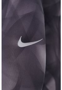 Nike Legginsy damskie kolor szary wzorzyste. Kolor: szary. Materiał: dzianina, włókno, tkanina, skóra, materiał. Technologia: Dri-Fit (Nike)