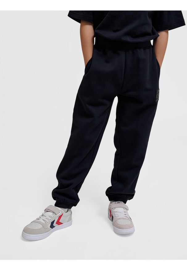 Regulowane spodnie dresowe dla dzieci Hummel Clean. Kolor: czarny. Materiał: dresówka. Sport: joga i pilates