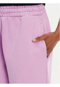 Hugo - HUGO Spodnie dresowe Nolasa_B 50545019 Różowy Loose Fit. Kolor: różowy. Materiał: bawełna