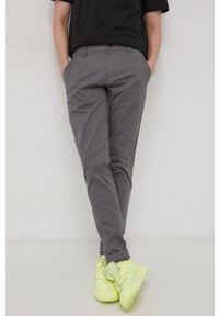 Tommy Jeans Spodnie męskie kolor szary w fasonie chinos. Kolor: szary. Materiał: materiał, bawełna, tkanina. Wzór: gładki