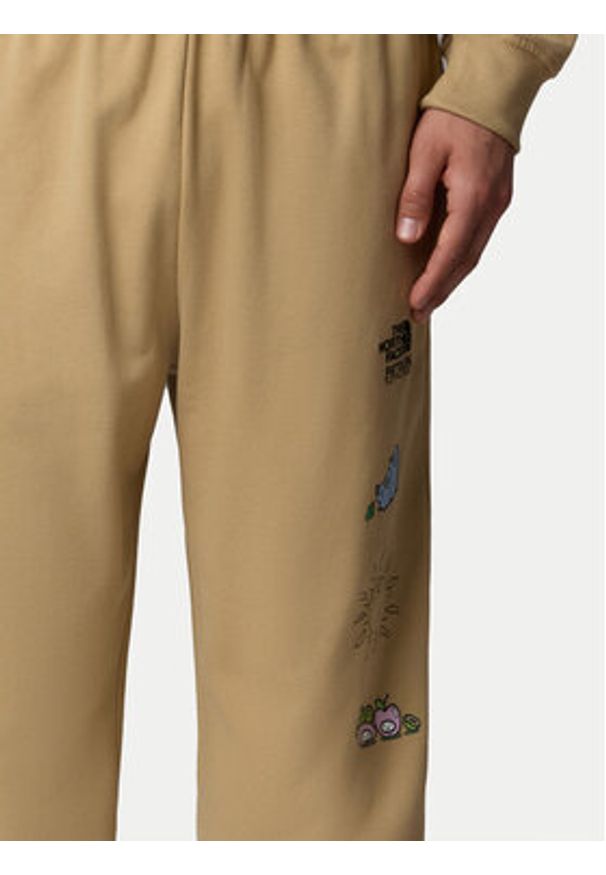 The North Face Spodnie dresowe Unisex Mountain Cleanup NF0A8C2W Beżowy Relaxed Fit. Kolor: beżowy. Materiał: bawełna