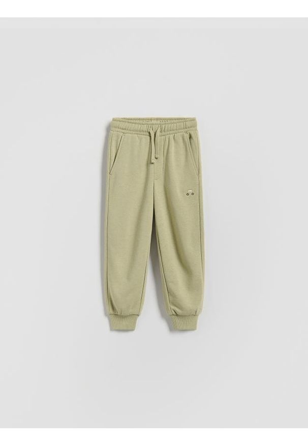 Reserved - Bawełniane spodnie jogger - jasnozielony. Kolor: zielony. Materiał: bawełna
