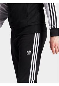 Adidas - adidas Spodnie dresowe adicolor Classics SST IL2488 Czarny Slim Fit. Kolor: czarny. Materiał: bawełna