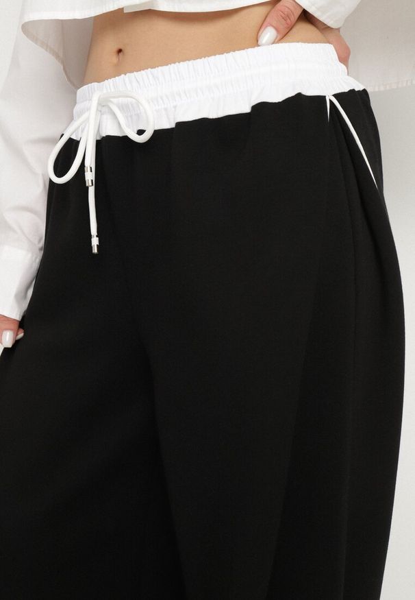 Born2be - Czarne Spodnie Dresowe z Wiskozą Wysokim Stanem i Lampasami Maithena. Okazja: na co dzień. Stan: podwyższony. Kolor: czarny. Materiał: dresówka, wiskoza. Styl: elegancki, casual