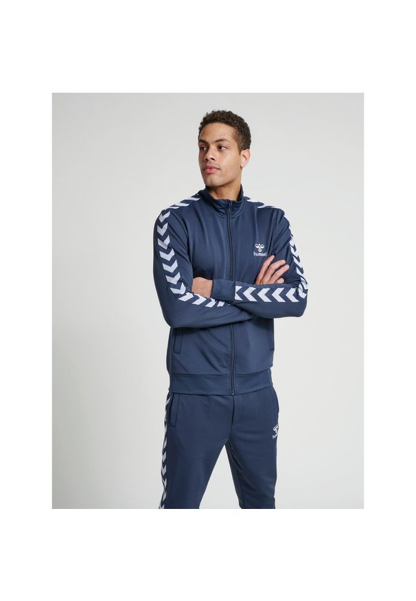 Kurtka Hummel Nathan 2.0 zip. Kolor: zielony, wielokolorowy, niebieski, szary. Materiał: dresówka