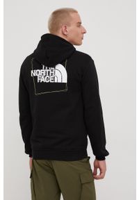 The North Face bluza bawełniana męska kolor czarny z kapturem z nadrukiem. Typ kołnierza: kaptur. Kolor: czarny. Materiał: bawełna. Wzór: nadruk