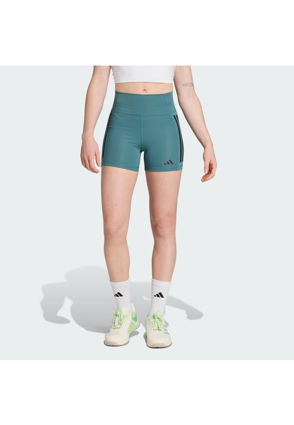 Adidas - Legginsy Optimé 3-Stripes 1/4 Short. Stan: podwyższony. Kolor: zielony, niebieski, wielokolorowy. Materiał: materiał. Technologia: ClimaCool (Adidas). Długość: krótkie. Sport: fitness