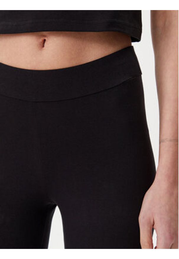 Puma Legginsy Essentials Metallic 685000 Czarny Slim Fit. Kolor: czarny. Materiał: bawełna