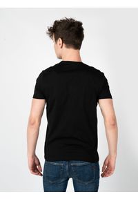 Diesel T-Shirt "T-Diegos" | A00828-0HAYU-9XX | Mężczyzna | Czarny. Okazja: na co dzień. Kolor: czarny. Materiał: bawełna. Wzór: nadruk. Styl: casual