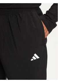 Adidas - adidas Spodnie dresowe Own The Run IK5024 Czarny Regular Fit. Kolor: czarny. Materiał: syntetyk. Sport: bieganie #5