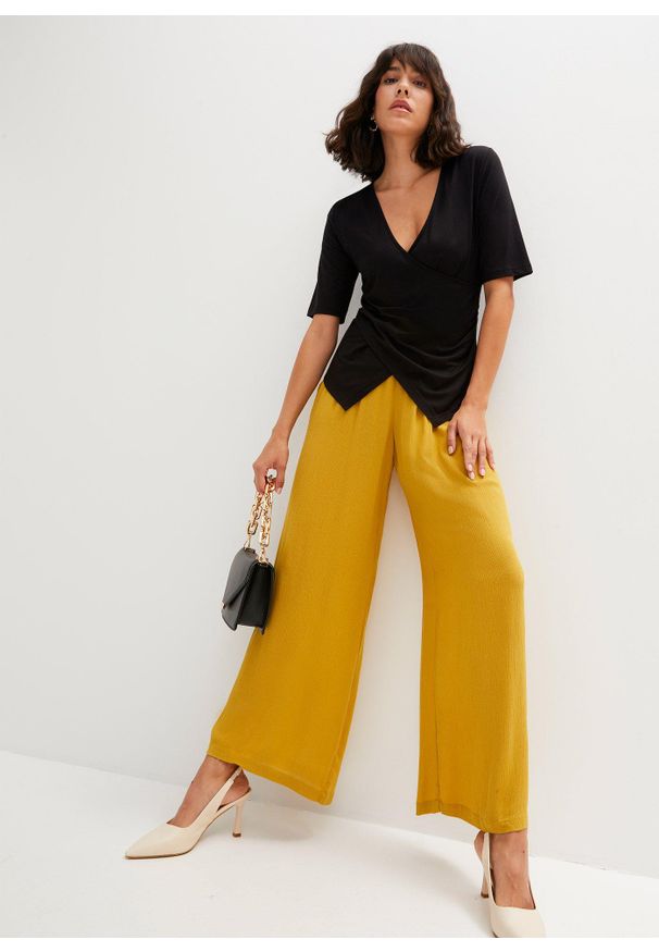 bonprix - Spodnie Marlena z lejącej wiskozy. Kolor: żółty. Materiał: wiskoza