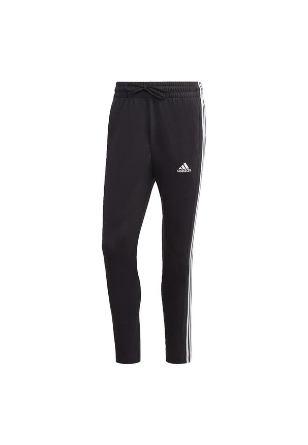 Adidas - Essentials Single Jersey Tapered Open Hem 3-Stripes Pants. Kolor: biały, wielokolorowy, czarny. Materiał: jersey
