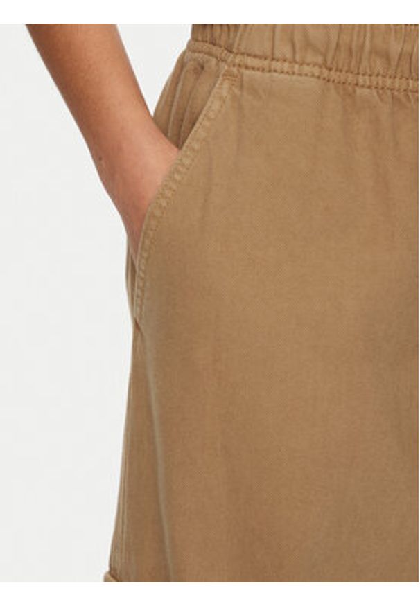 Tommy Jeans Spodnie materiałowe DW0DW20531 Beżowy Relaxed Fit. Kolor: beżowy. Materiał: bawełna