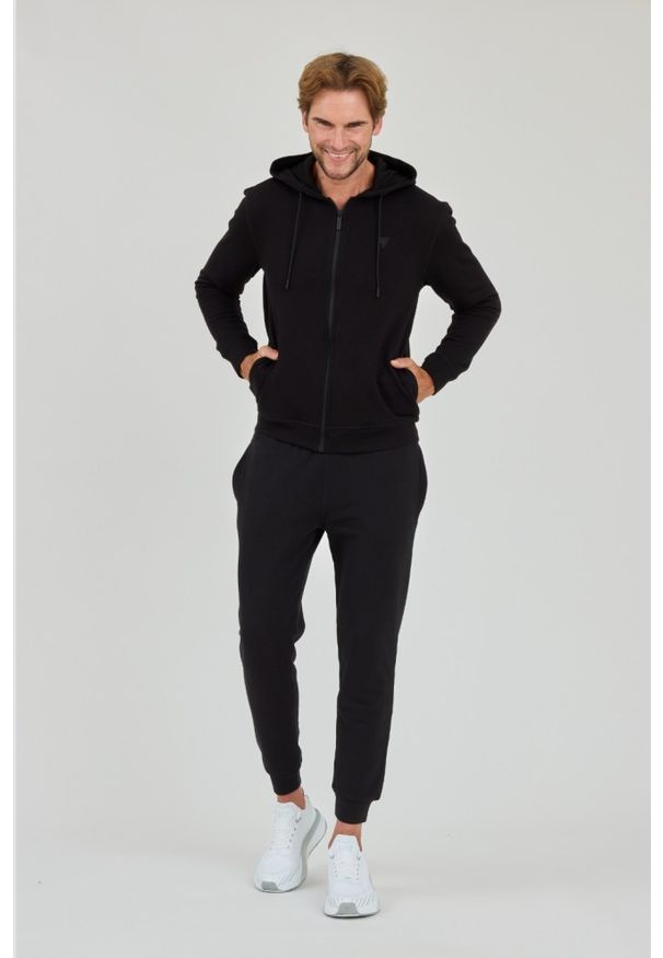 Guess - GUESS Czarne męskie spodnie dresowe, Rozmiar XL. Kolor: czarny. Materiał: dresówka