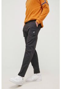 New Balance spodnie męskie kolor czarny proste. Okazja: na co dzień. Kolor: czarny. Materiał: tkanina. Styl: casual