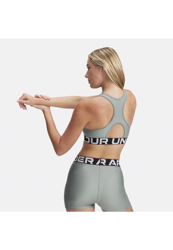 Stanik sportowy Under Armour HeatGear Authentics Mid Branded Bra. Kolor: zielony. Sport: fitness